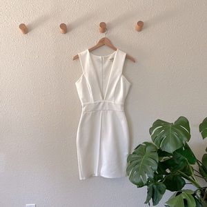 Low V body con mini dress. Size 6. Brand: Twin sisters.